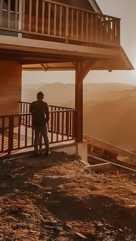 Person Standing Outside The House